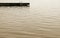 Swimming dock with ladder at the edge of beautiful calm waters