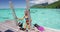 Swimming girl coming out of snorkel swim water in coral reefs of Tahiti ocean