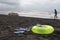 Swimming glasses, sandal, Water scooter and Floating Ring on beach. Blurred people on sand beach. In the summer vacation