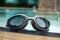 Swimming googles on the swimming pool