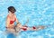 Swimming Instructor learn child swim.