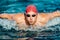 Swimming man. Male Swimmer athlete doing butterfly swim stroke. Male sport fitness man wearing swimming goggles and swim