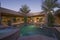 Swimming Pool In Backyard Of Modern Home