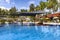 Swimming pool among a beautiful garden in Pelangi Beach Resort Spa hotel