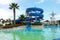 Swimming pool and blue spiral water slide in a hotel, Turkey