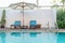 Swimming pool blue sunbed umbrella