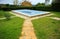 Swimming pool with a blue tarp for protection in winter