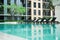 Swimming pool and chair in condominium