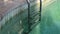 Swimming Pool with clear turquoise water and stairs underwater