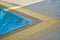 Swimming pool corner with water drainage grate with shady
