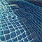 Swimming pool digital illustration: clear water and square blue tiles.