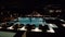 Swimming pool with fountain in night illumination at the luxury hotel