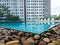 Swimming pool among high rise condo buildings ,Bangkok, Thailand