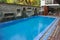 Swimming pool of hotel.Beautiful luxury outdoor swimming pool with stair in hotel and resort for holiday travel