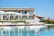 Swimming pool with jacuzzi by beach at the modern luxury hotel