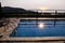 Swimming pool of luxury holiday villa, amazing nature view landscape sea. Relax near swimming pool with handrail, deck chairs.