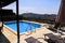 Swimming pool of luxury holiday villa, amazing nature view landscape sea. Relax near swimming pool with handrail, deck chairs.