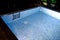 Swimming pool at night in evening with sub water lights. Night swimming for concept relax holiday travel.