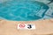 Swimming pool with No Diving warning sign and 3 ft depth marker