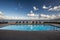 Swimming pool in an old resort next to a beach in a summer