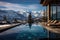 Swimming pool overlooking snow-capped mountains