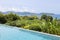 Swimming pool overlooking view andaman sea mountains and blue sk