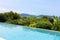 Swimming pool overlooking view andaman sea mountains and blue sk