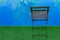 Swimming pool side outside space empty rustic wooden chair without people here green grass and blue water horizontal simple