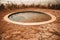 swimming pool surrounded by dried earth, symbolizing drought and water scarcity