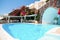 Swimming pool on terrace in traditional white cave house on Santorini island