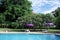 Swimming pool in tropical garden in sunny day