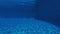 Swimming pool underwater, blue water background with copy-space