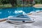 Swimming pool vacuum cleaner hose on cement floor, Manual equipment for cleaning pool