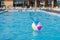 Swimming pool view with inflatable ball