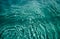 Swimming pool water background with drops and bubbles in tidewater green color