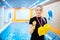 Swimming school for children, Portrait trainer woman holds inflatable armbands for kids accessories