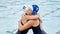 Swimming, sports women and hug for support, happy training and competition win. Athlete people or team together with