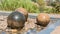 Swimming stone sphere fountains