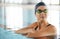 Swimming, thinking and a woman on a break in a pool from training, competition or fitness. Idea, serious and a