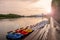 Swimming transport: boats, catamarans for walks on the lake at the pier on the river. beautiful evening sunset on the