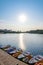 Swimming transport: boats, catamarans for walks on the lake at the pier on the river. Sunny morning on the Yenisei river