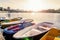 Swimming transport: boats, catamarans for walks on the lake at the pier on the river. Sunny morning on the Yenisei river