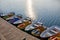 Swimming transport: boats, catamarans for walks on the lake at the pier on the river. Sunny morning on the Yenisei river