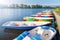 Swimming transport: boats, catamarans for walks on the lake at the pier on the river. Sunny morning on the Yenisei river