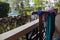 Swimwear and beach towels are dried on the poolside terrace in a tropical hotel