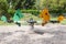 Swing-balancer on springs in the form of horses on a green playground. Empty playground, Green area for games