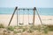 Swing on the beach with the sea view on background, summer vibes, castelldefels