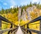 Swing Bridge over Ohre River at Svatos Rocks, Czech: Svatosske skaly, at autumn time, Czech Republic