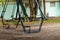 Swing for children abandoned in a park in autumn in ukraine in the city of dnipro