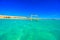 Swing in crystal clear azure water - Orange Bay Beach with white beach - paradise coastline of Giftun island, Mahmya, Hurghada,